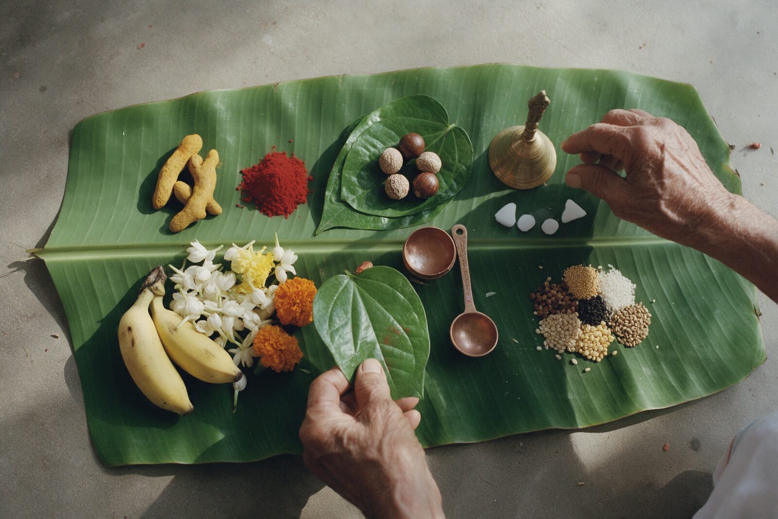 Illustrative arrangement of pooja items on a banana leaf.